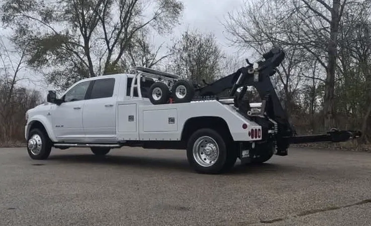 Brampton wrecker equipment securing damaged vehicle